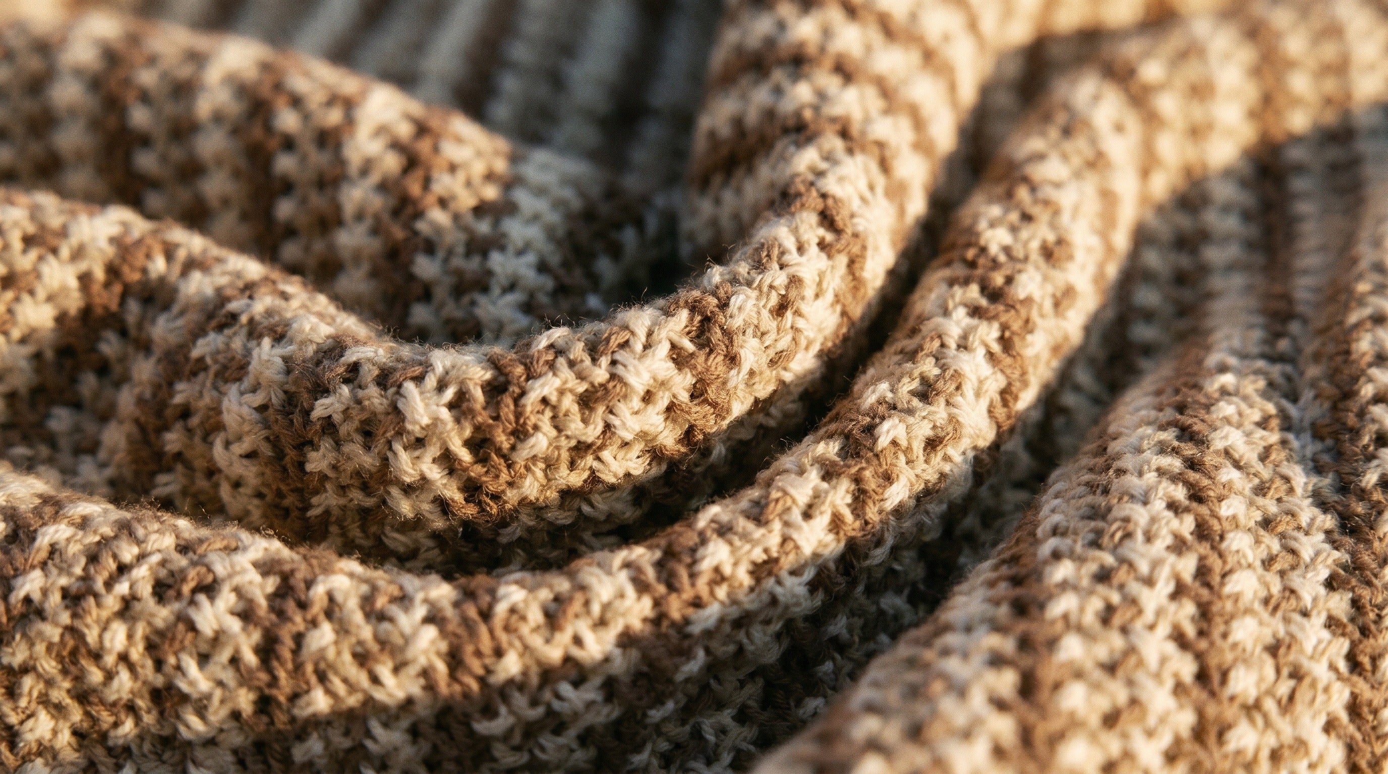 Folded Giza Mills knitwear on a workshop bench in Cairo